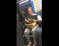 Woman reads book called How to Do Nothing 