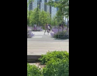 Group of dancers perform in a circle for video 