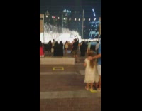 Woman white dress selfie video monopod fountain