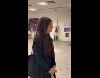 Woman wear hijab cry at art exhibit