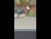 Collab IITW - Woman in pink top poses by the car on the street