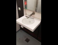 Submitter shows overflowing sink on public restroom 