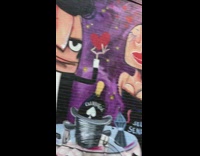 Hell's Kitchen restaurant wall art mural with woman black dress and man in tuxedo