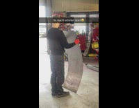 Guy wiggles metal sheet makes noise 