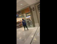 Two guys match pokemon display at store in mall