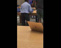 Man dances to music at the Apple store 