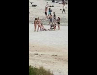 Girl striped shorts twerk dance crowded beach
