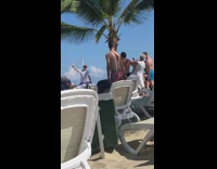 Pt. 2 Man holds up cup of coffee in the sky while woman takes picture