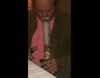 Pink shirt dad smokes bong white tablecloth 