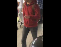 blue couch orange pillow subway station