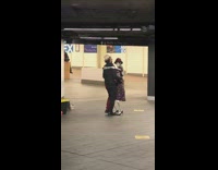 Salsa dancing with skeleton in subway station