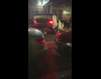 Car flipped over in traffic accident in street