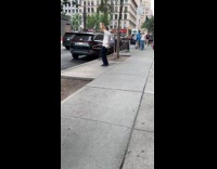 Man in white shirt use hula hoop 