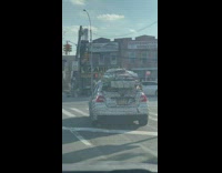 Car decorated for Christmas wrapped gifts on roof