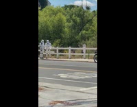 Two people stormtrooper costumes guy motorcycle street