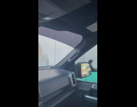 Two women films a person in mike Myers in a cart