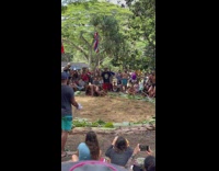 Man Takes Down Opponent on Sand at Wrestling Match