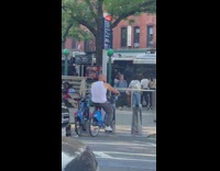 Man rides parked Citibike backwards
