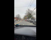 Guy rides tall bike on the road