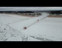 Drone shot of frozen Grand Haven pier