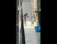 Guy purple hoodie black bike face mask 