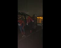 Van in raining parking lot friends dressed as spiderman 