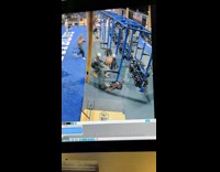 Guys lined up behind man barbell squat