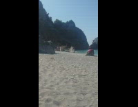 Black dress girl beach sand light reflector 