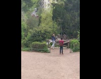 Woman blue jacket wooden fence park pictorial