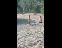 Bikini girl poses with coconut under butt