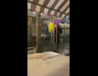 Man with colorful umbrella blocking rain