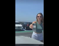 Woman selfie coffee car hood honk shocked 