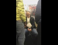 zoom in of guy sleeping with mouth open on subway