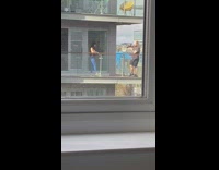 Girl black tank top stand on balcony 