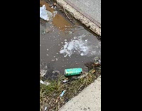 Smoke come out from dirty water puddle