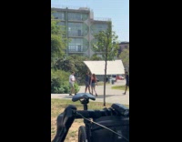 Submitter shows woman at park filming video