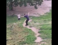guy skateboarding down hill falls down