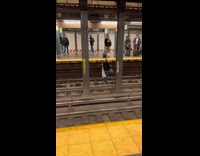 Woman dance at trailway in subway NYC 