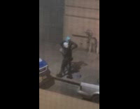 Men on street filming music video