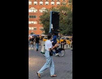 Collab Subway Creatures - Man balance sofa on head ride bike