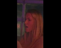 Blonde supportive woman takes video friend dance