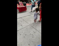 Black shirt guy red table sidewalk dummies 