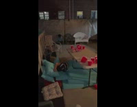 Guy standing on ladder throws his friend off ladder onto the table