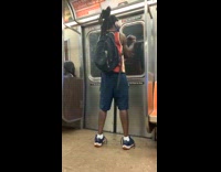 Red shirt guy rotates arm dances subway 