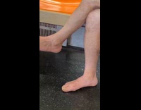 Man barefoot sit crossed leg in train