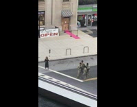 Woman take selfie with group of soldiers