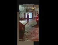 Woman black top stretch arms night music