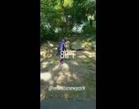 man in purple saran wrap park stone steps