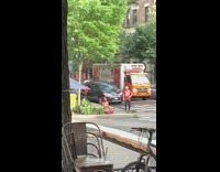 Girl sits meditates sidewalk red shirt guy 
