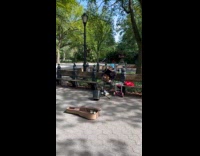 Collab WINY - Man sings performs with guitar at park